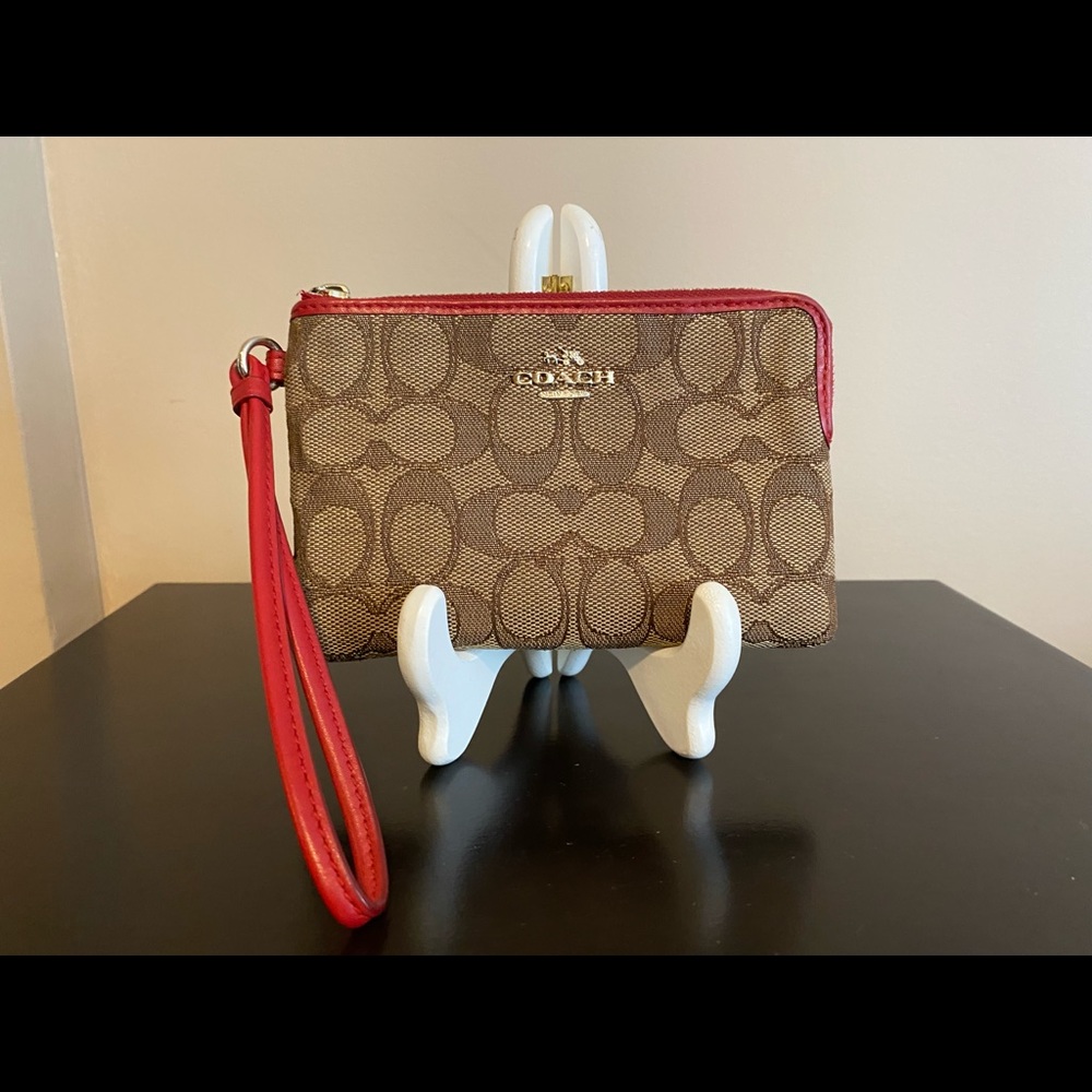 Tan and coral coach wristlet